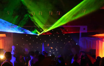 DJ with starcloth backdrop and laser show